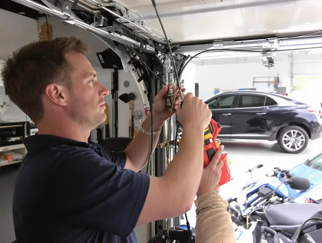 West Haven Garage Door Repair safety certified technician performing cable replacement in West Haven